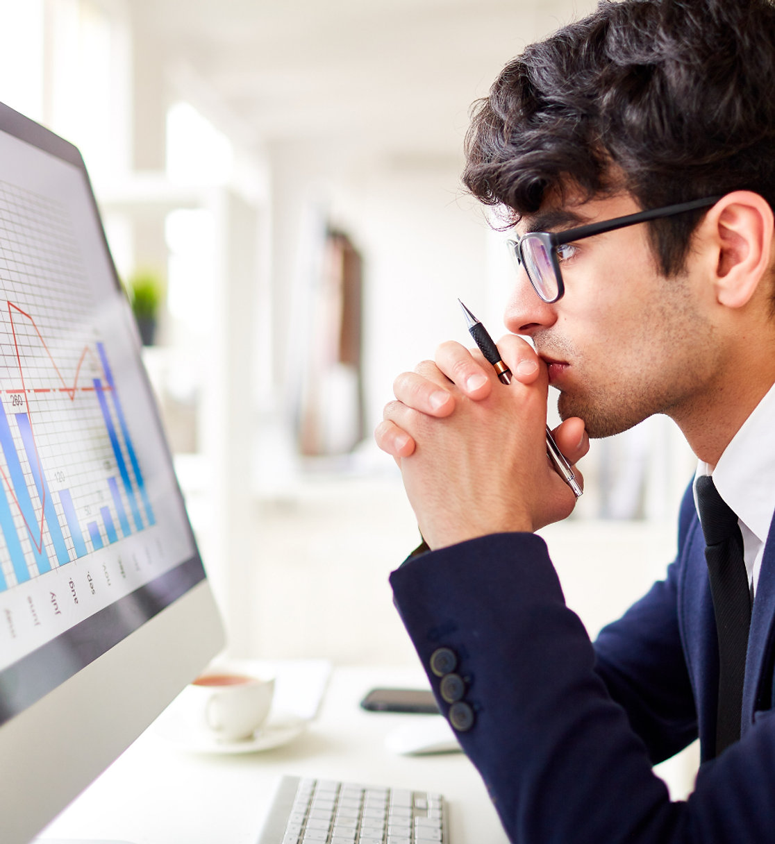 Retail trader reviewing options trading charts on a laptop